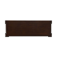 Top-down view of dark wood dresser surface.