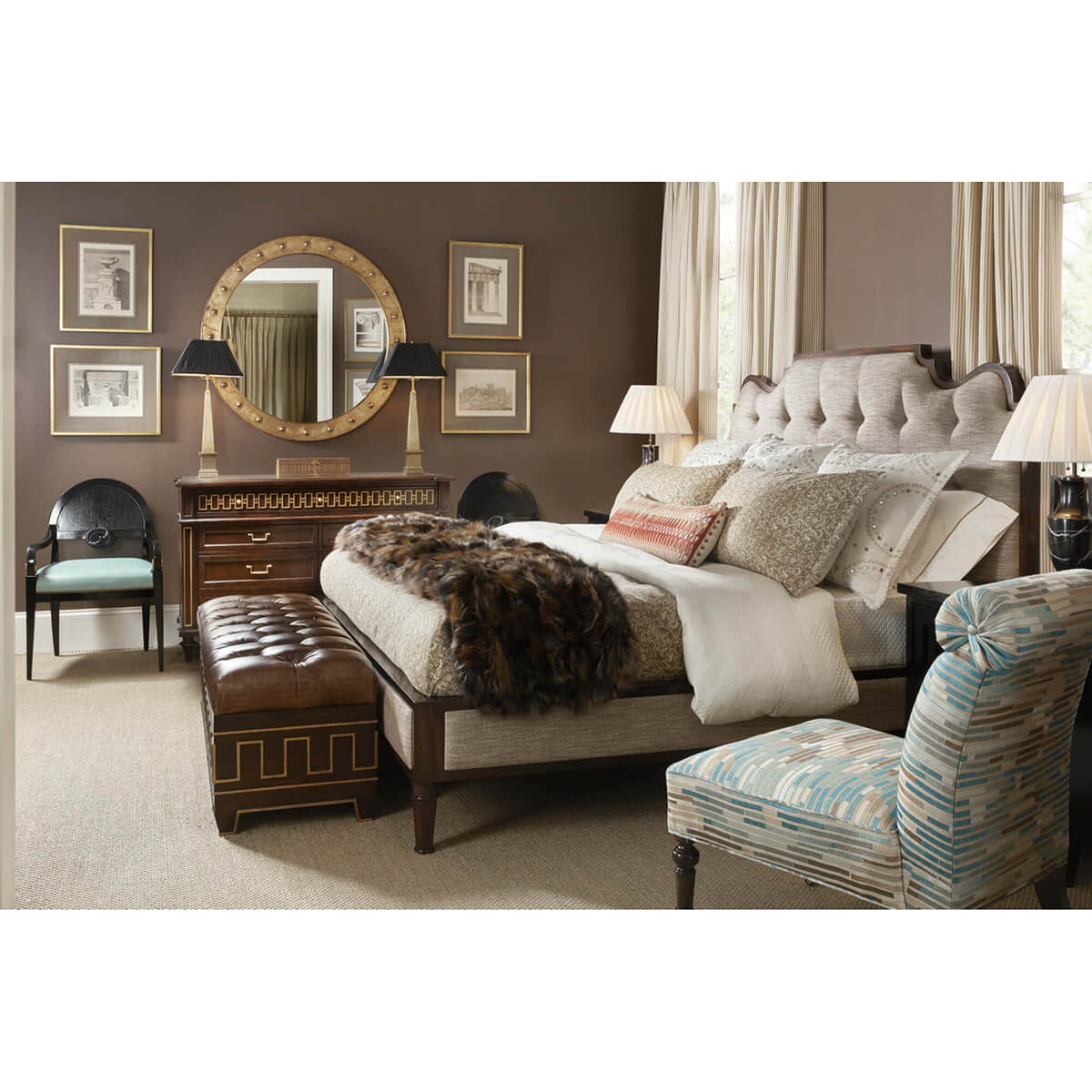 Dresser in luxurious bedroom setting with decorative mirror.
