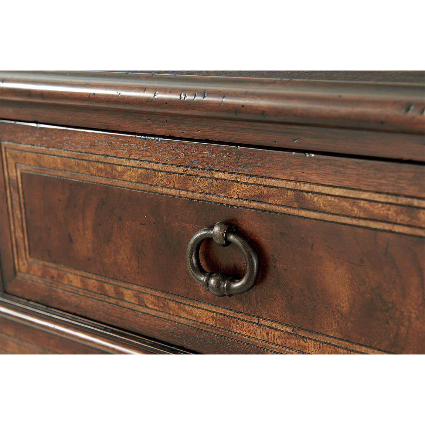 Close-up of French Neoclassic dresser drawer handle detail.