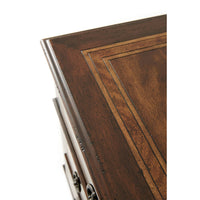 Corner detail of French Neoclassic dresser with wood inlay.