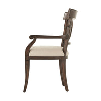 Side view of French Provincial armchair, elegant curved wood.