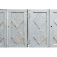 Close-up of diamond pattern on sideboard doors.
