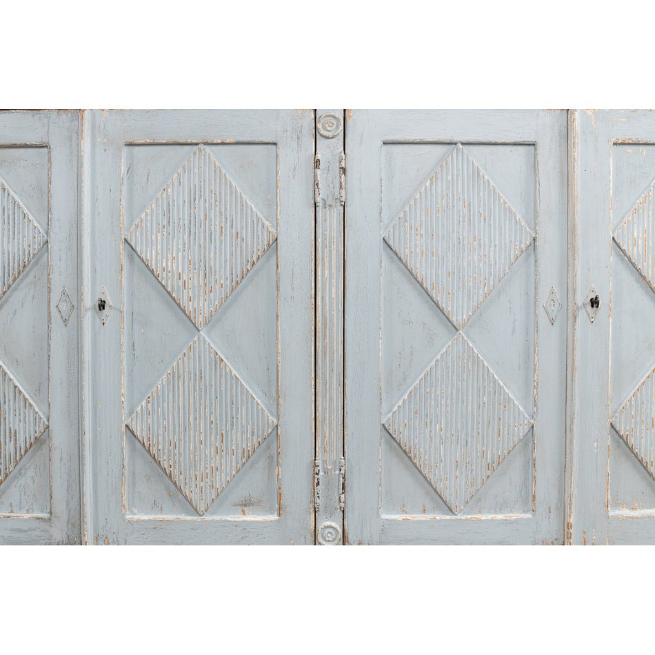 Close-up of diamond pattern on sideboard doors.