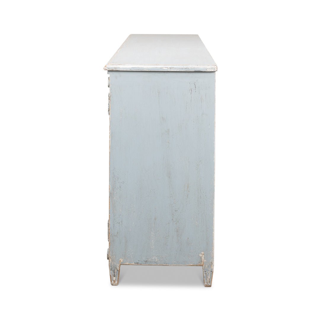 Side view of blue painted sideboard.