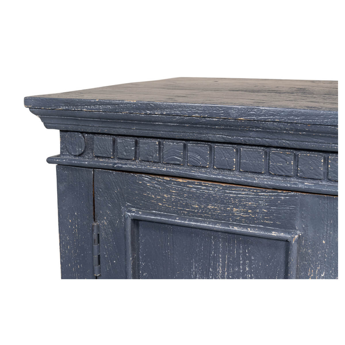Detailed corner trim of blue provincial credenza.