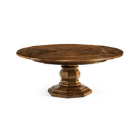 Round dining table with a sturdy pedestal base.