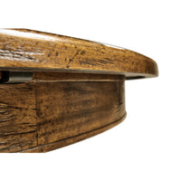Side detail of round dining table edge.