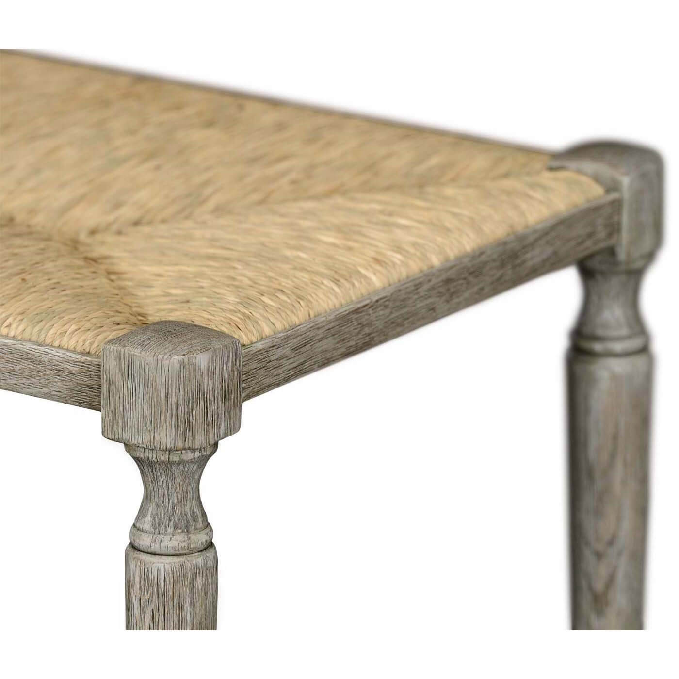 Close-up of French Provincial bench woven seat detail.