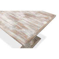 Close-up of distressed wooden tabletop of dining table.