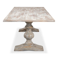 Side view of tabletop and pedestal base dining table.