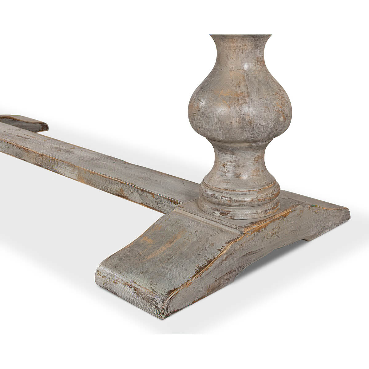 Detailed shot of pedestal base of refectory table.
