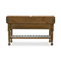 Back view of wooden kitchen island with shelf.