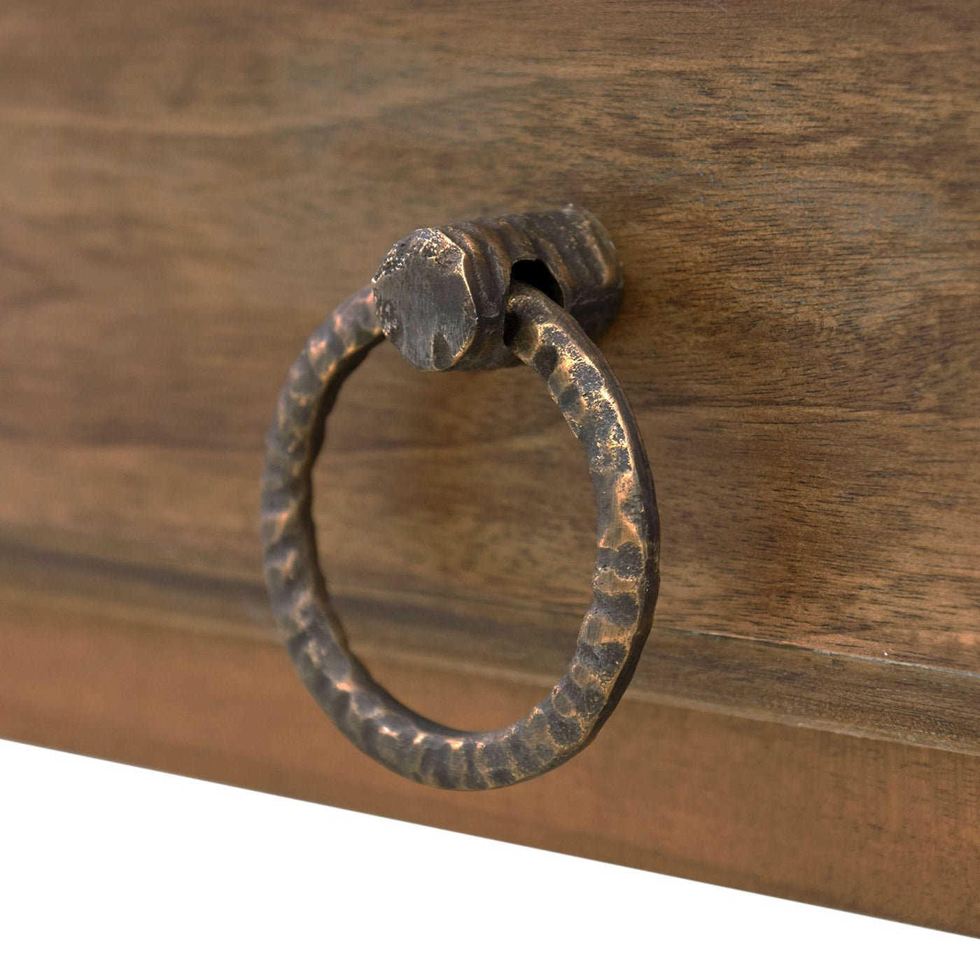 Detailed view of rustic metal drawer pull on island.