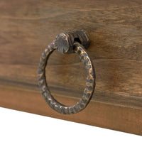 Detailed view of rustic metal drawer pull on island.