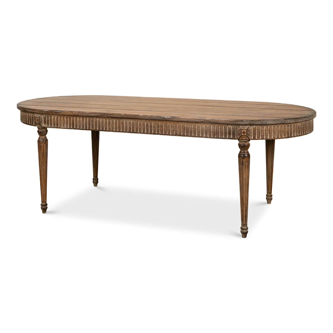 Angled view of wooden oval dining table, decorative details.