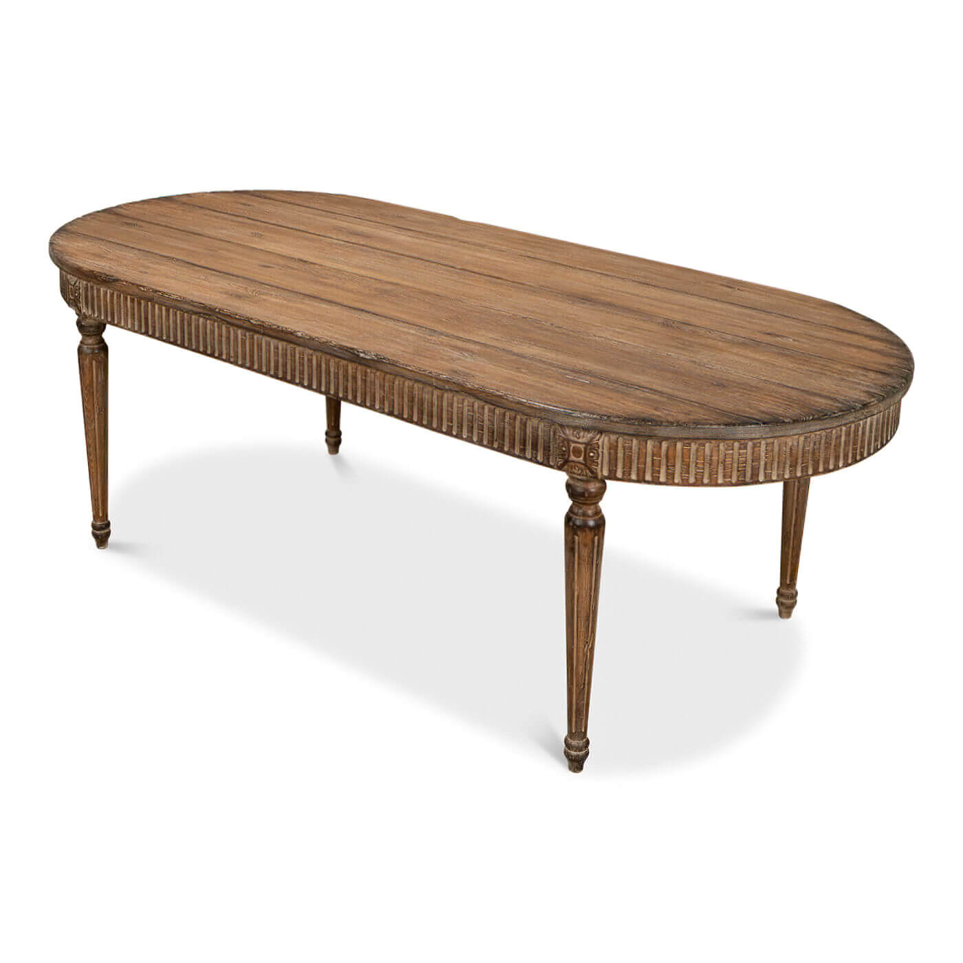 Top-down angled view of oval dining table, distressed finish.