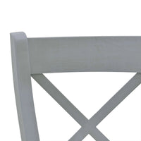 Close-up of dining chair's X-back details.