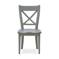 Wooden dining chair with X-back design, front view.