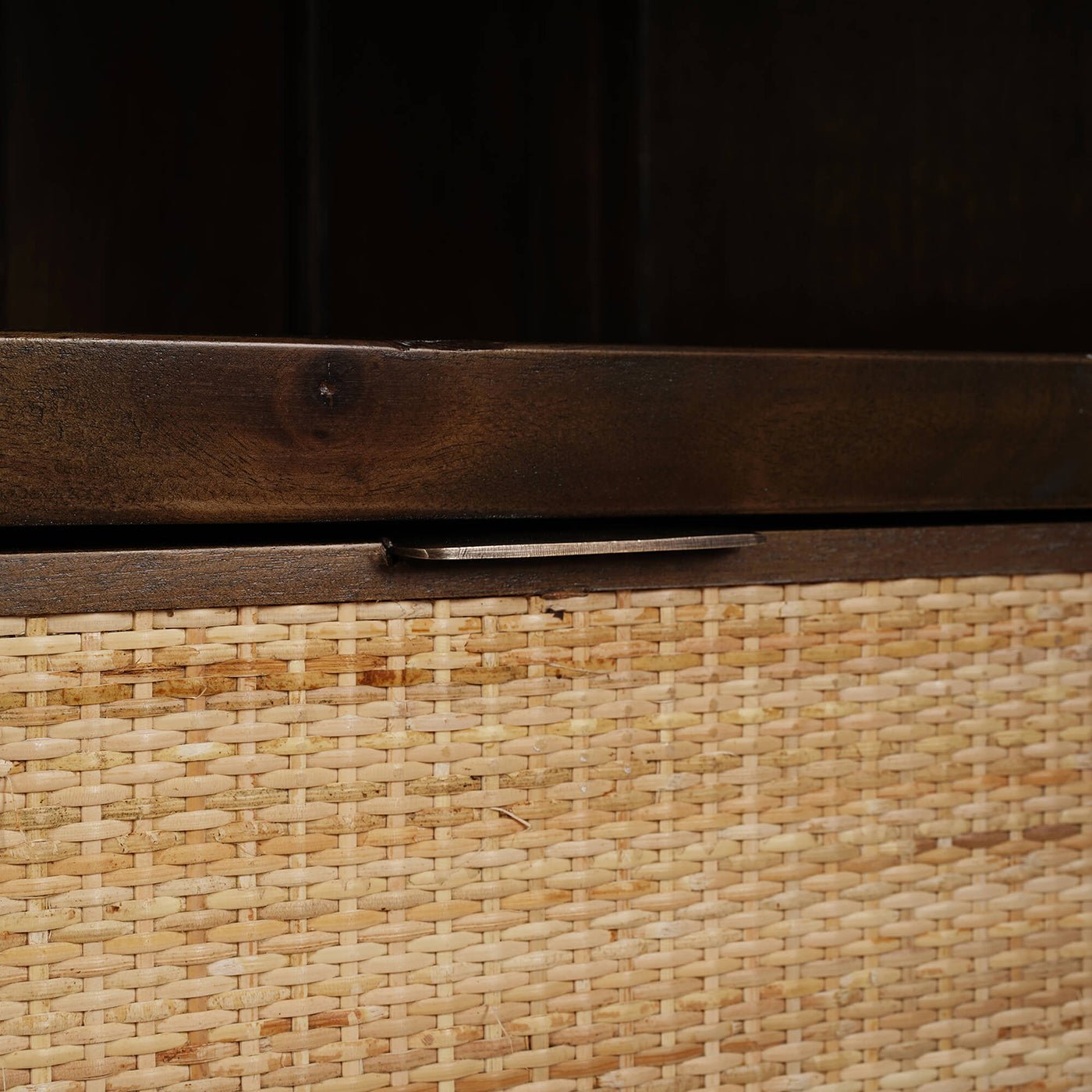 Wicker basket drawer detail in French Provincial display cabinet.