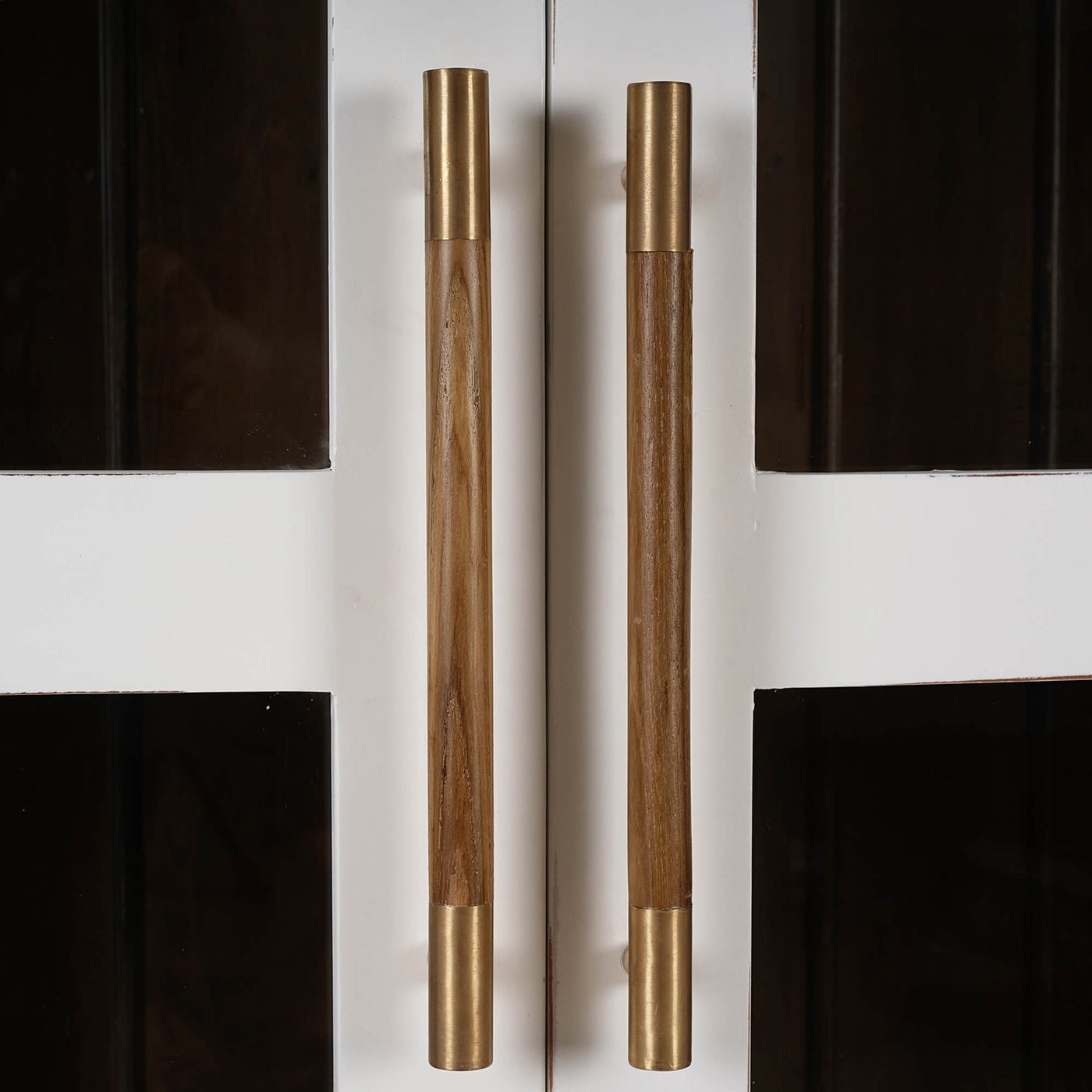 French Provincial cabinet handles, wood and brass detail.