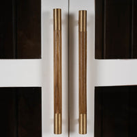 French Provincial cabinet handles, wood and brass detail.