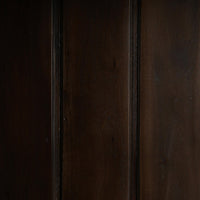 Interior wood paneling inside French Provincial display cabinet.