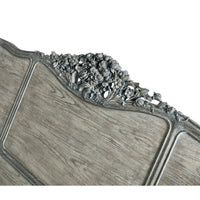 Floral carving on bed headboard from top angle.