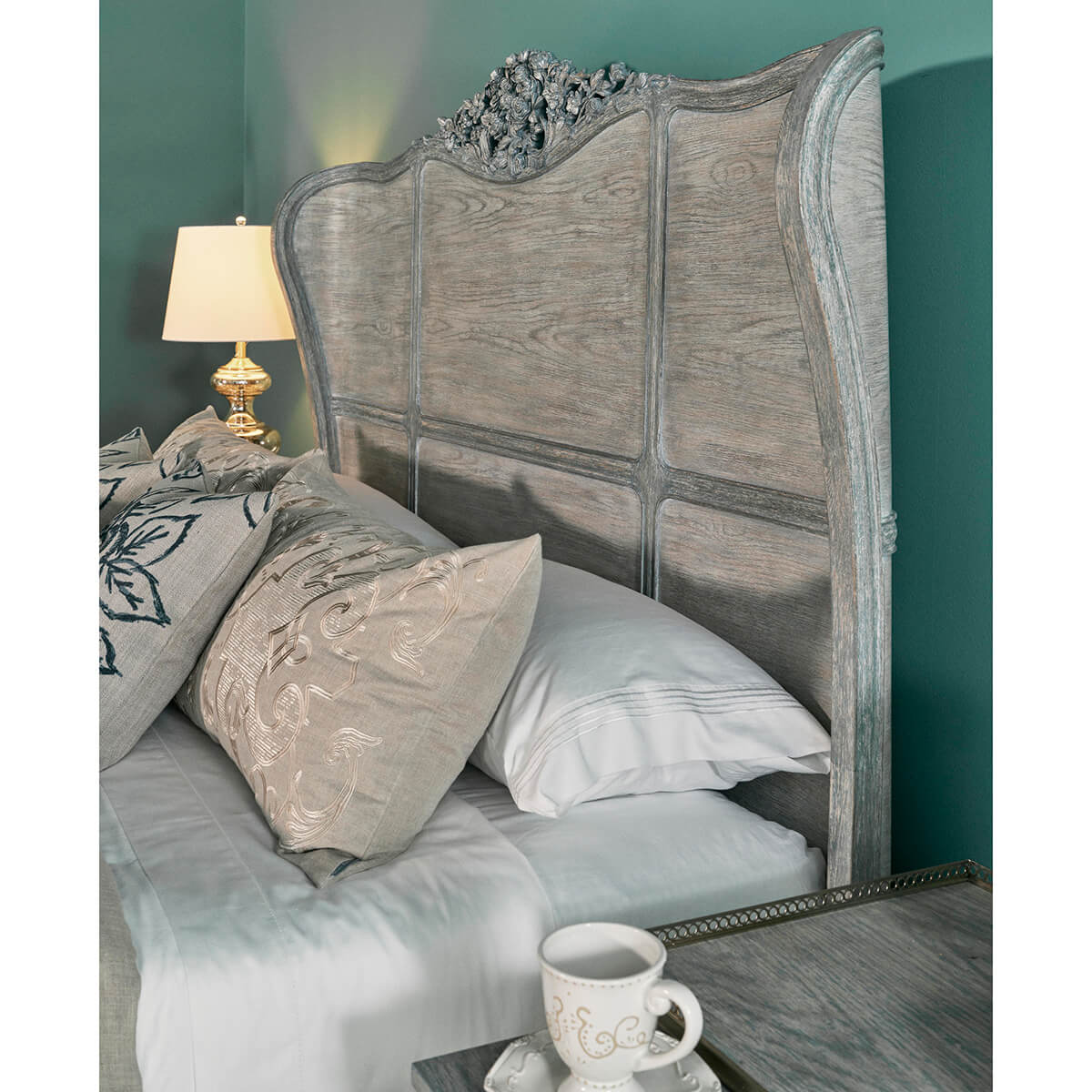 Close-up of bed headboard with bedding detail.