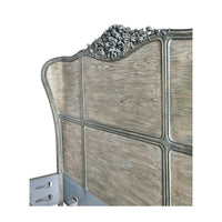 Side angle of headboard with floral detail.