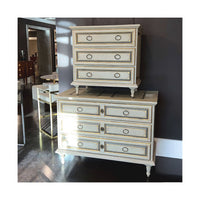 Two French Provincial nightstands in modern showroom.