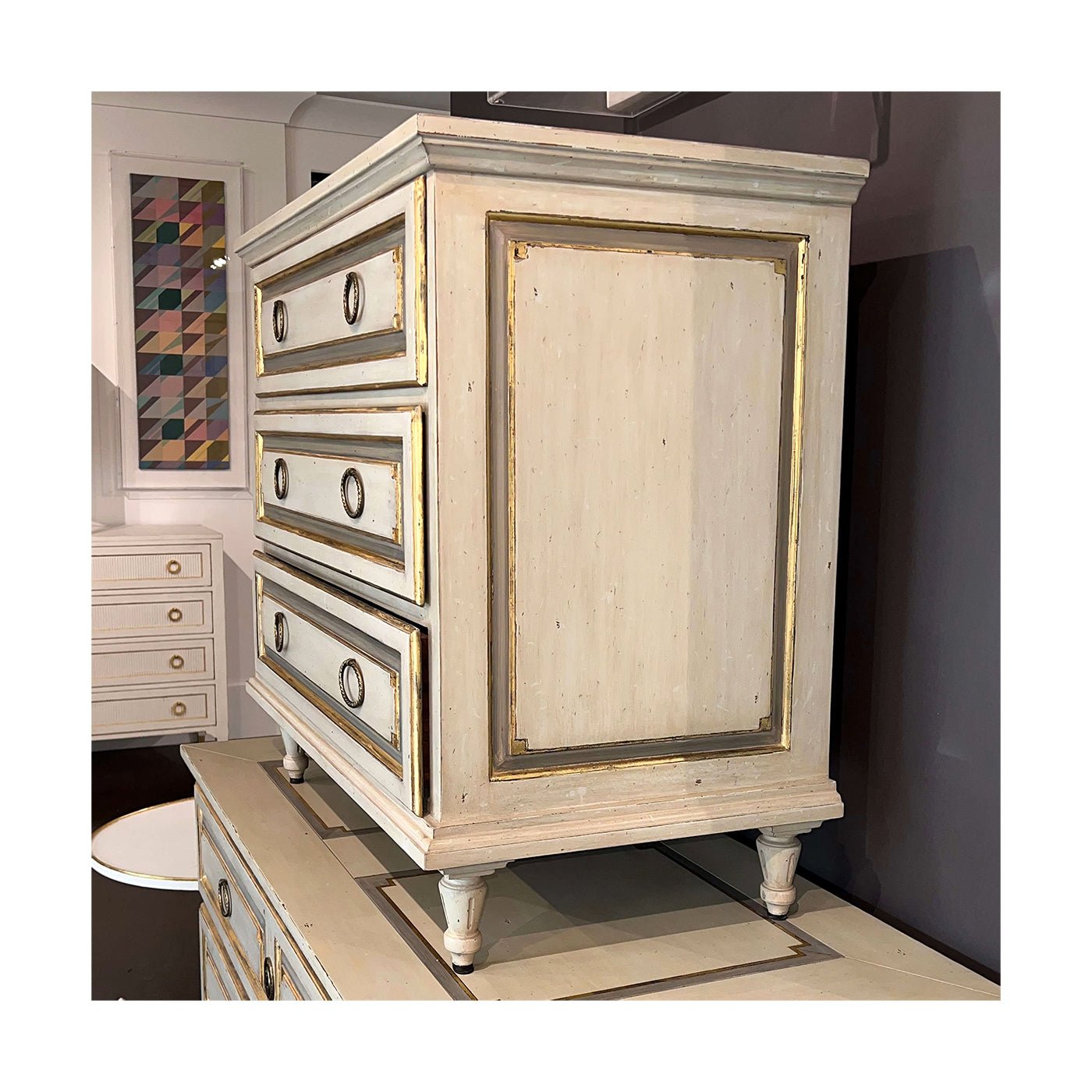 French Provincial nightstand on display, angled side view.