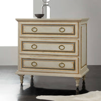 Elegant French nightstand on dark floor, front view.