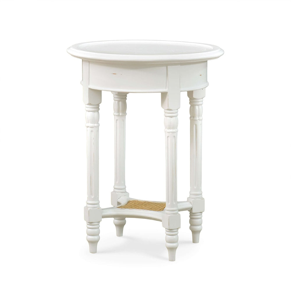 White painted round end table side view.