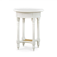 White painted round end table side view.