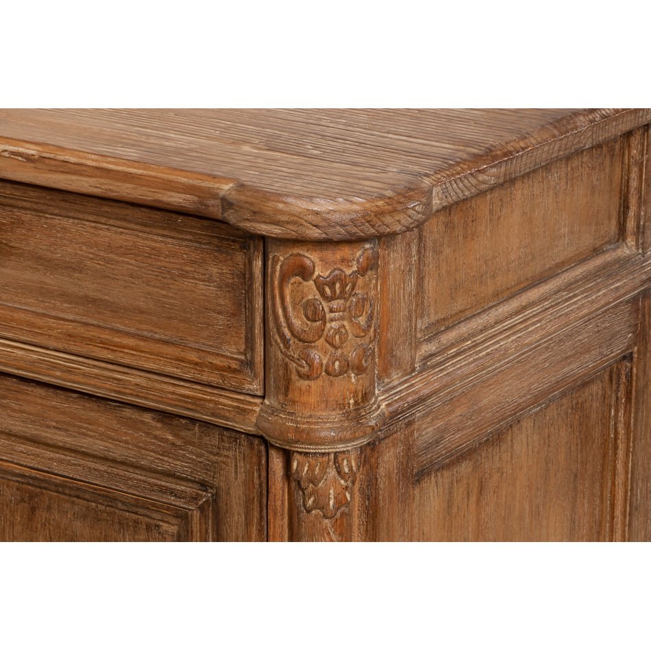 Close-up of carved corner detail on sideboard.