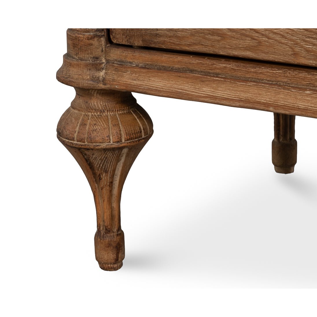 Close-up of sideboard leg, intricate design visible.