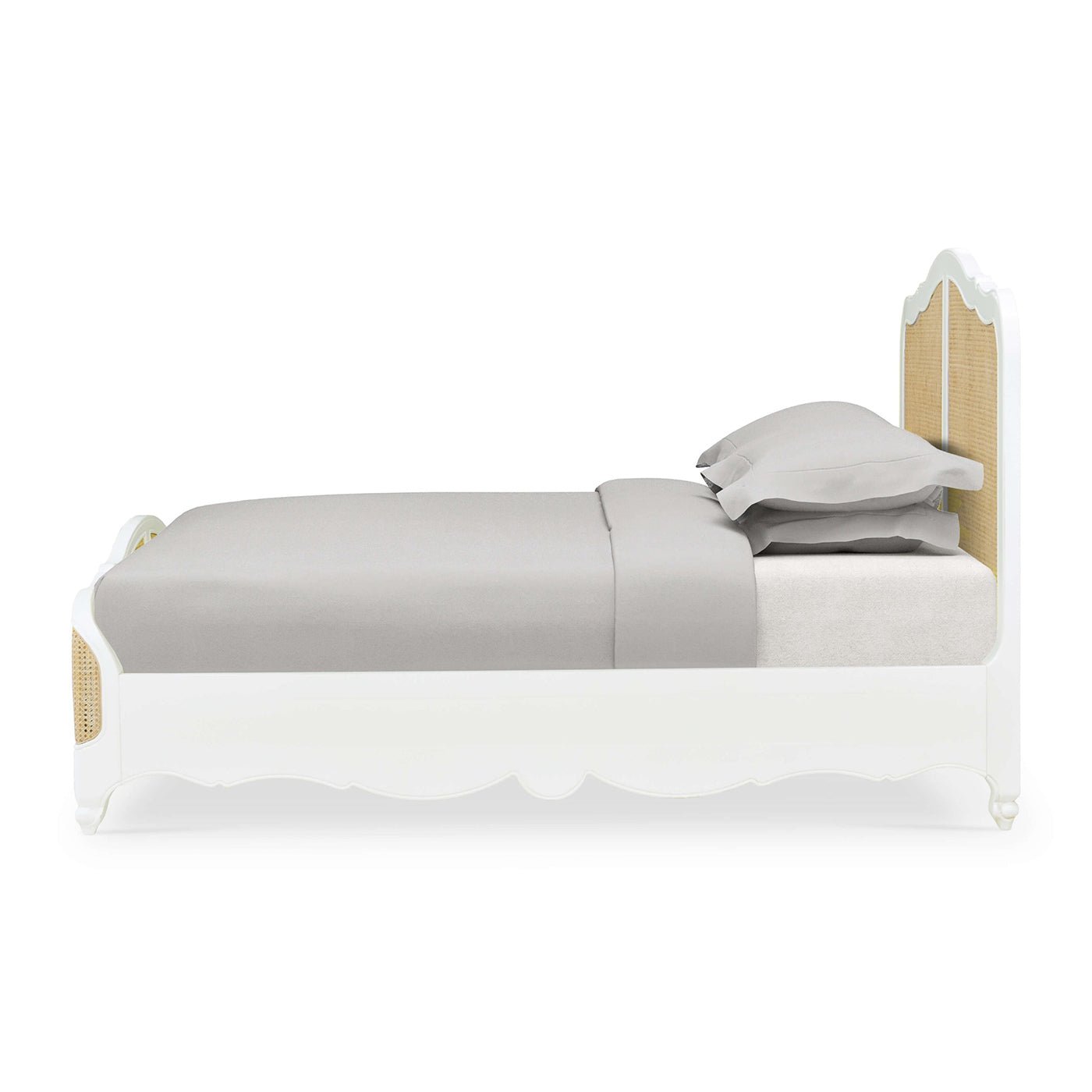 Side view of French Provincial queen bed.