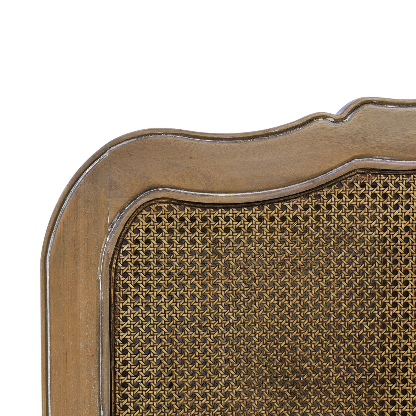 Close-up of French provincial bed, detailed straw weave.