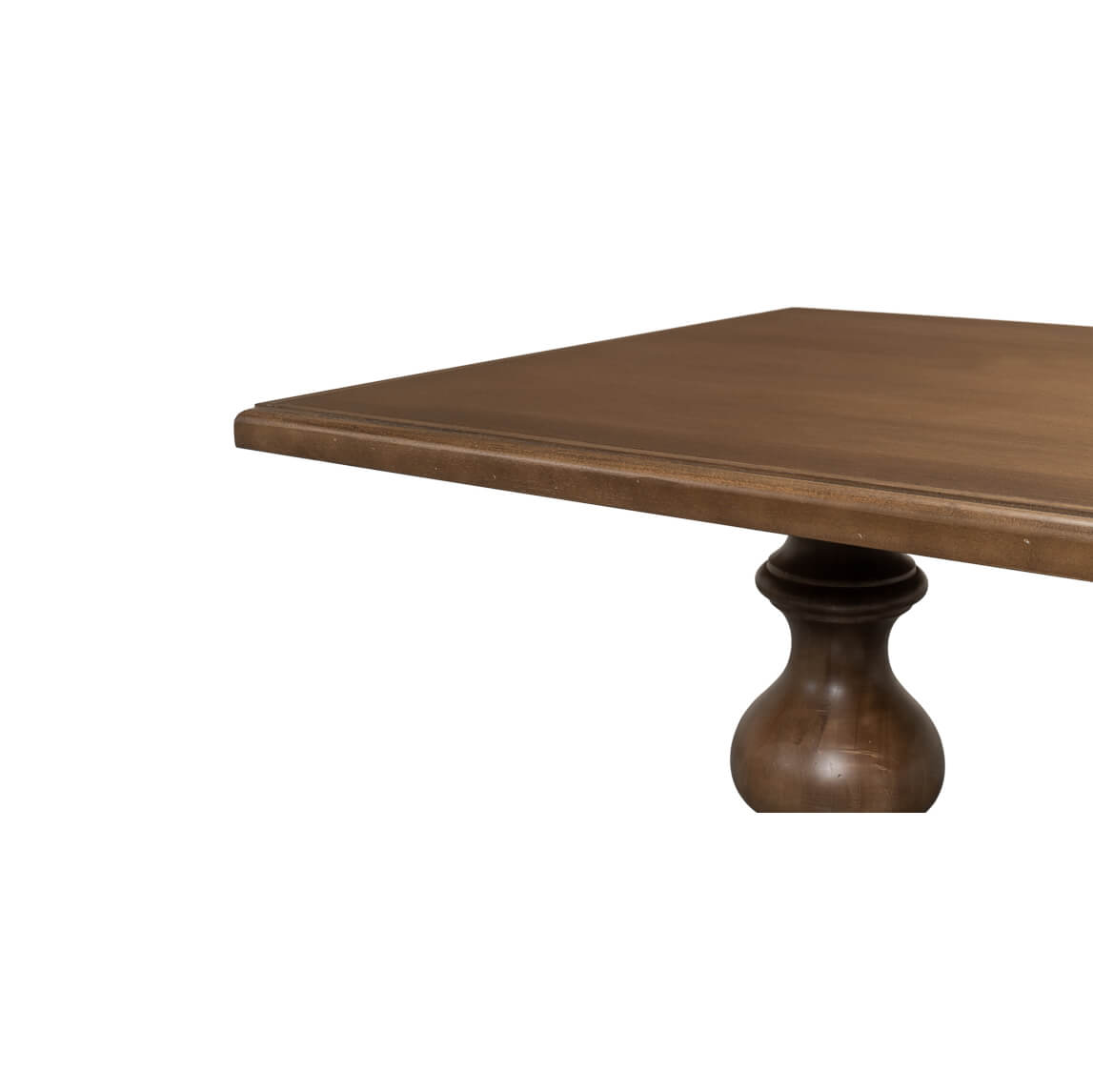 Corner close-up of wooden dining table top.