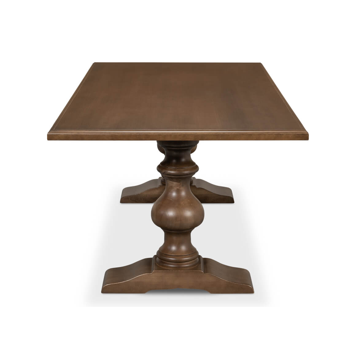 End view of wooden table with pedestal legs.