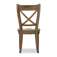 Rustic dining chair back view with X-back detail.