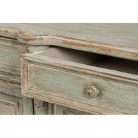 Drawer pulled open on French Provincial sideboard.