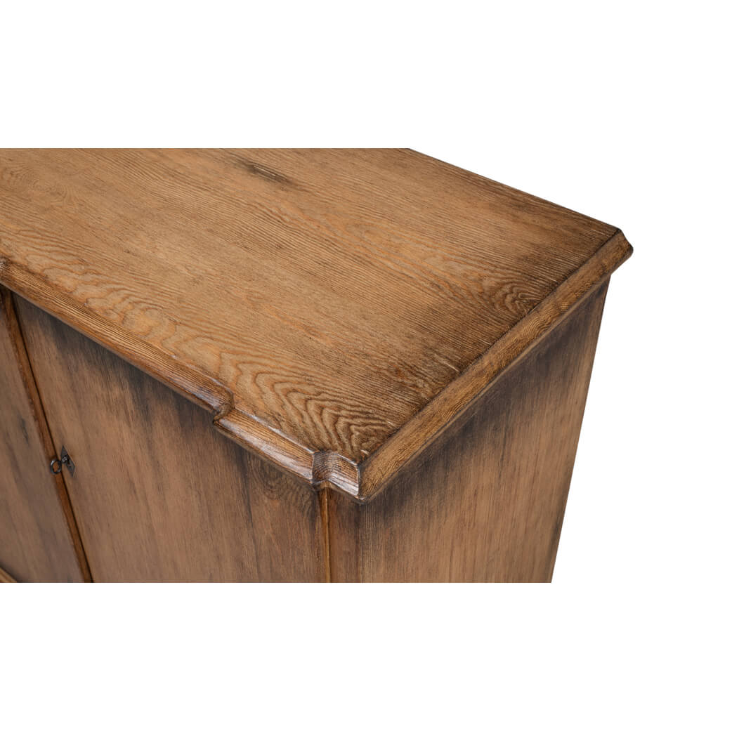 Close-up of French Provincial sideboard top corner detail.