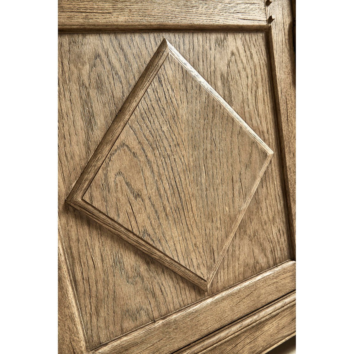 Close-up of sideboard door with diamond pattern.