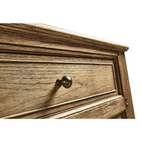 Close-up of sideboard drawer knob detail.