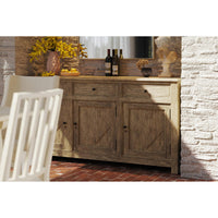 Sideboard styled in dining area with décor items.