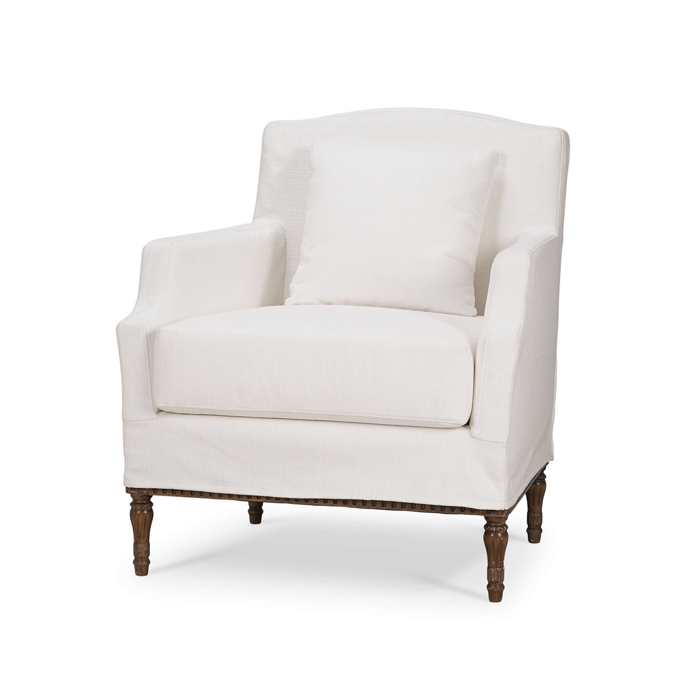 White slip cover armchair with wooden legs, angled view.