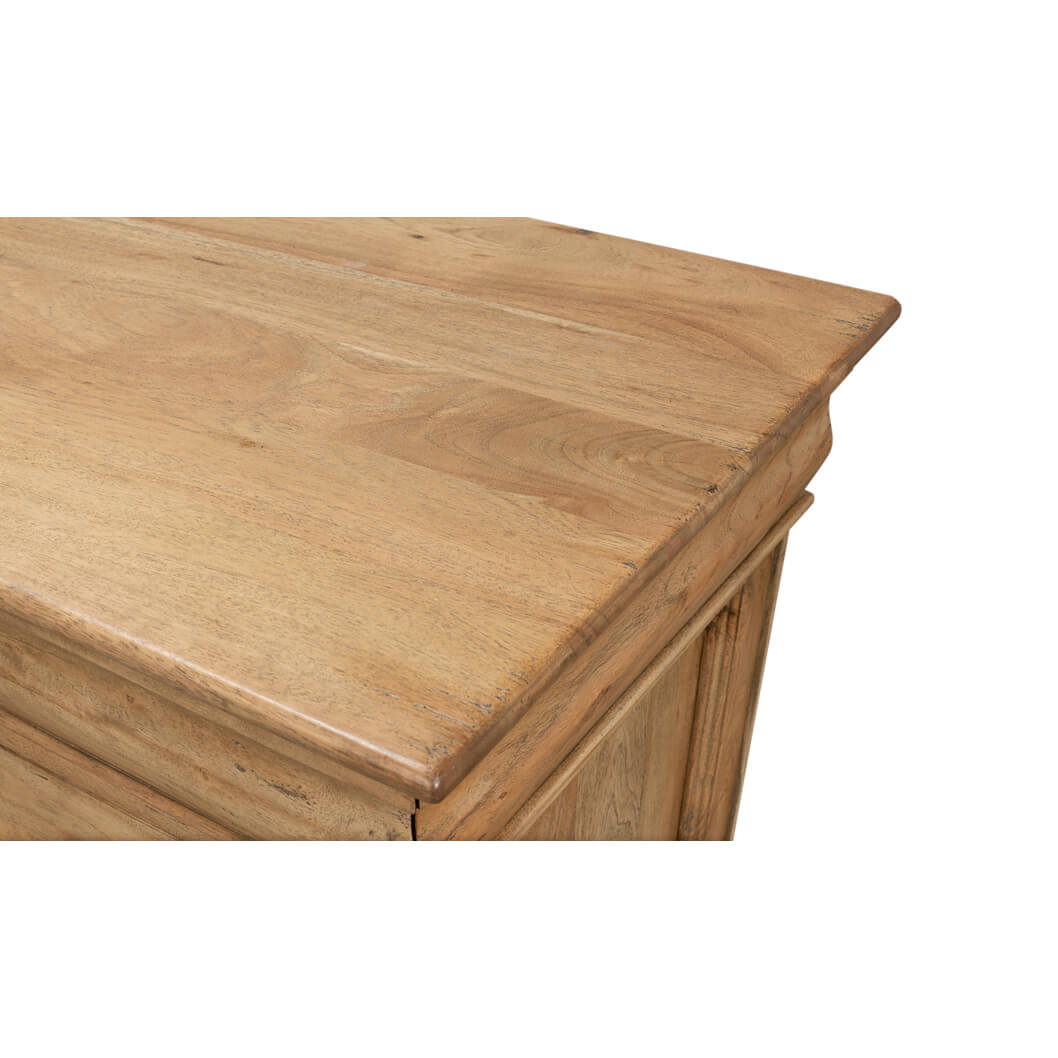 Close up of corner detail on wooden sideboard.