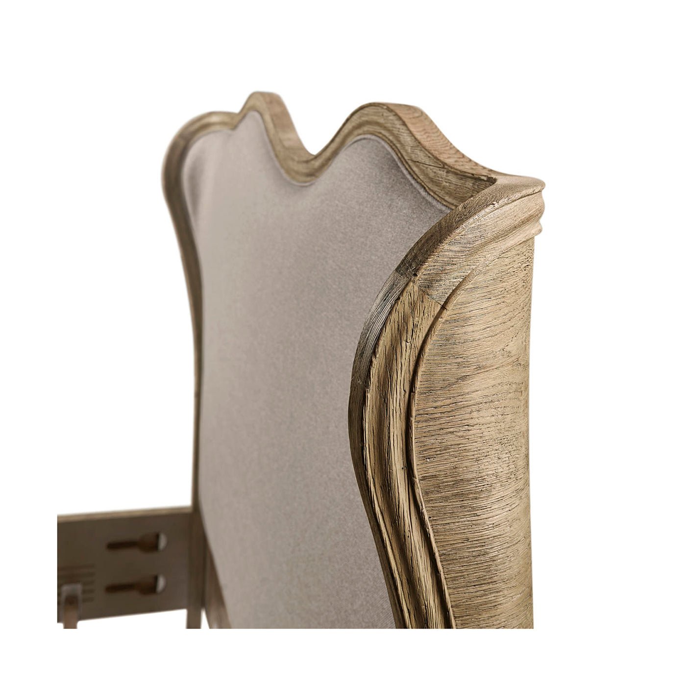Close-up of French Provincial bed headboard corner.