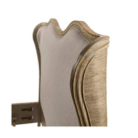 Close-up of French Provincial bed headboard corner.